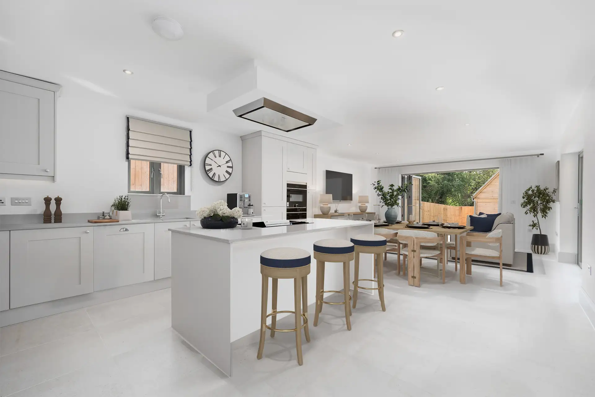 Open plan kitchen diner with light island and patio doors to garden