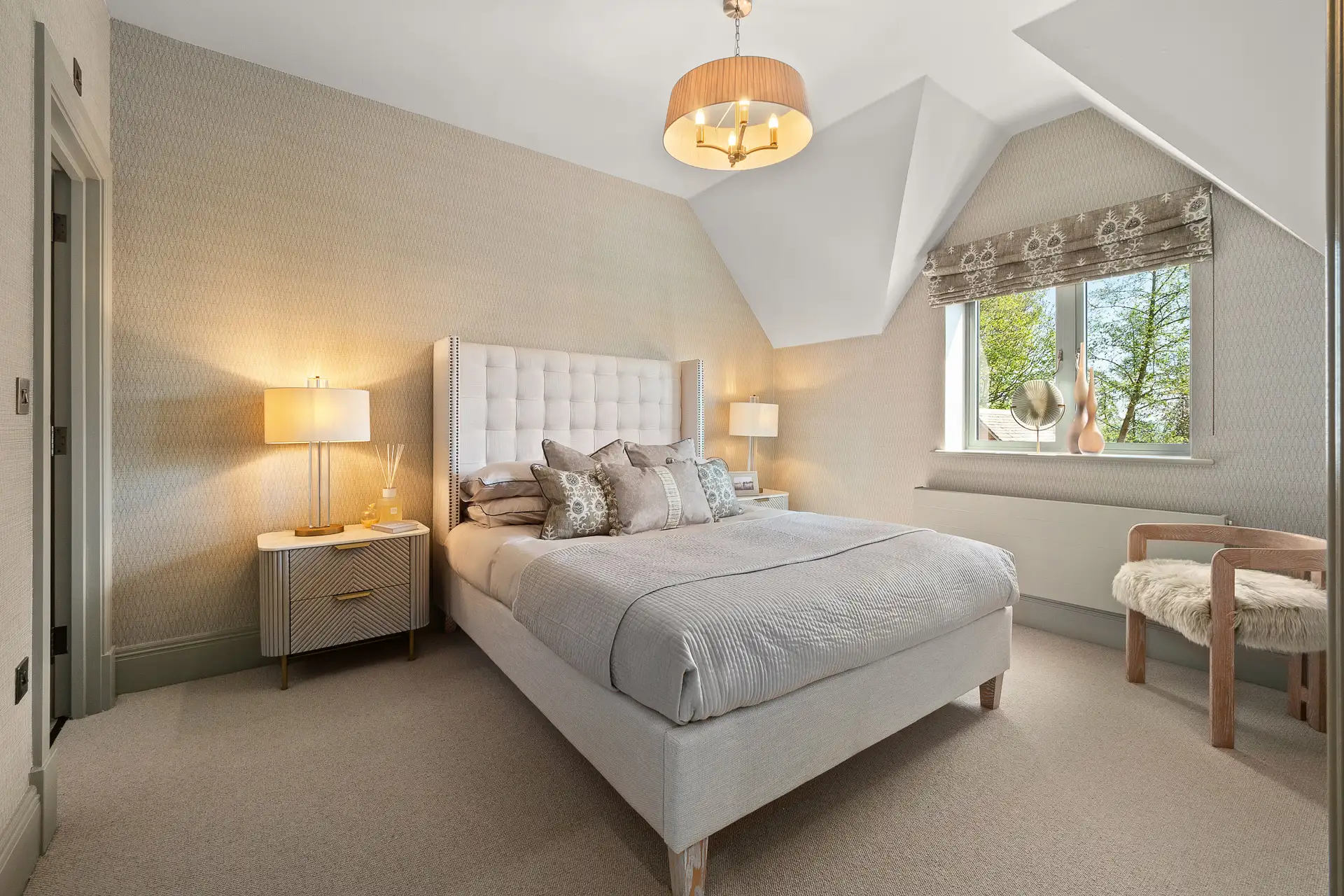 Double bedroom with wallpaper and double window