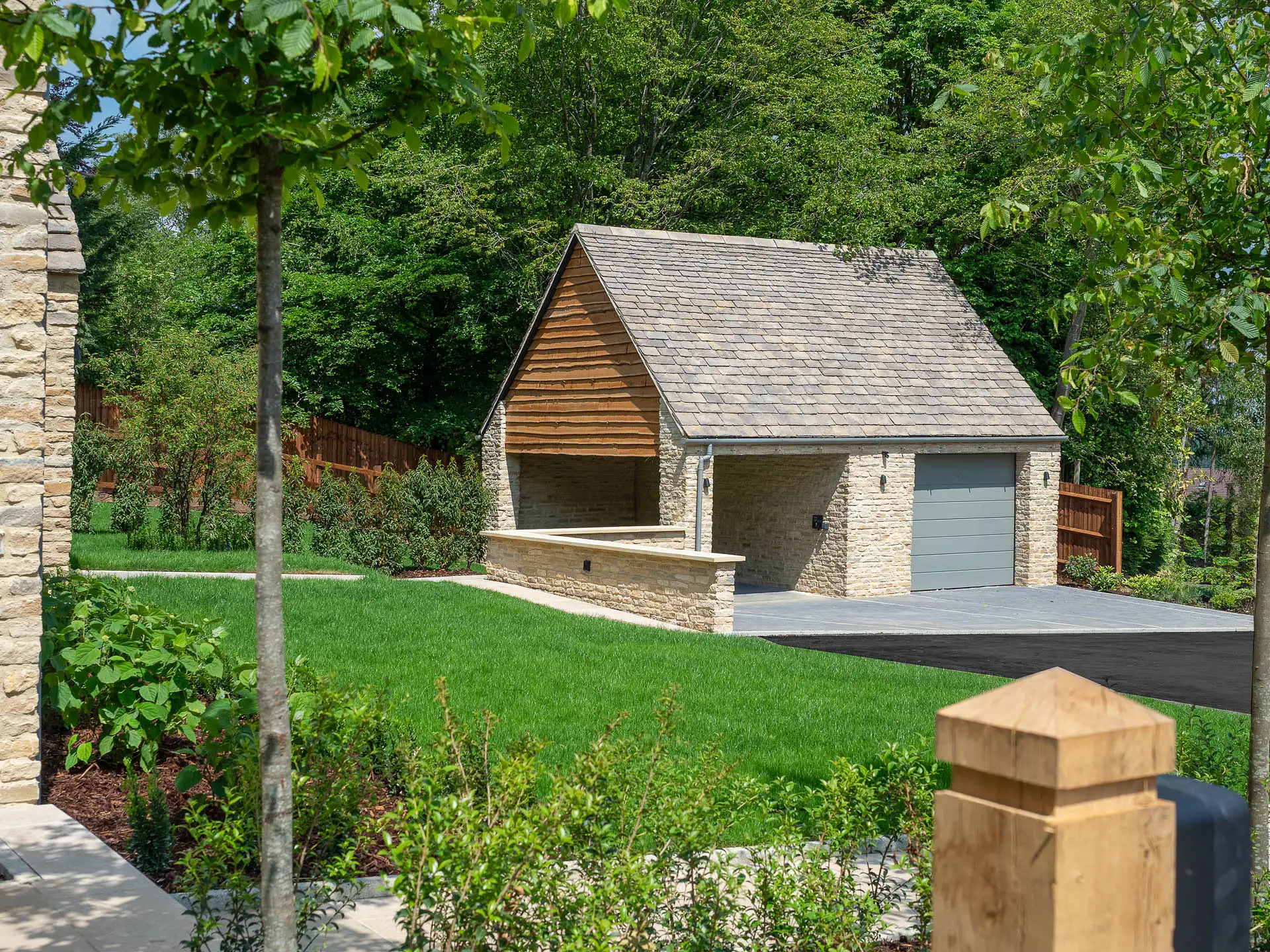 Outbuilding with garage and car parking cover