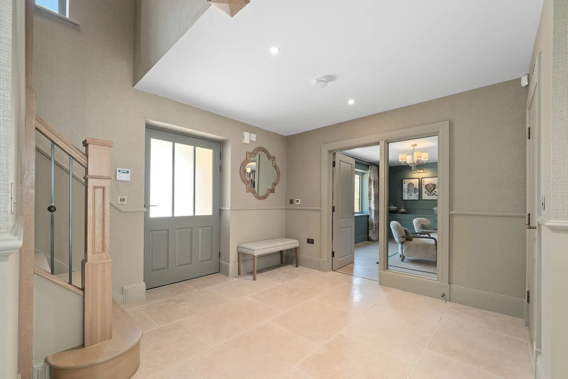 Entrance with light grey, beige colour, wooden stairs and light tiles