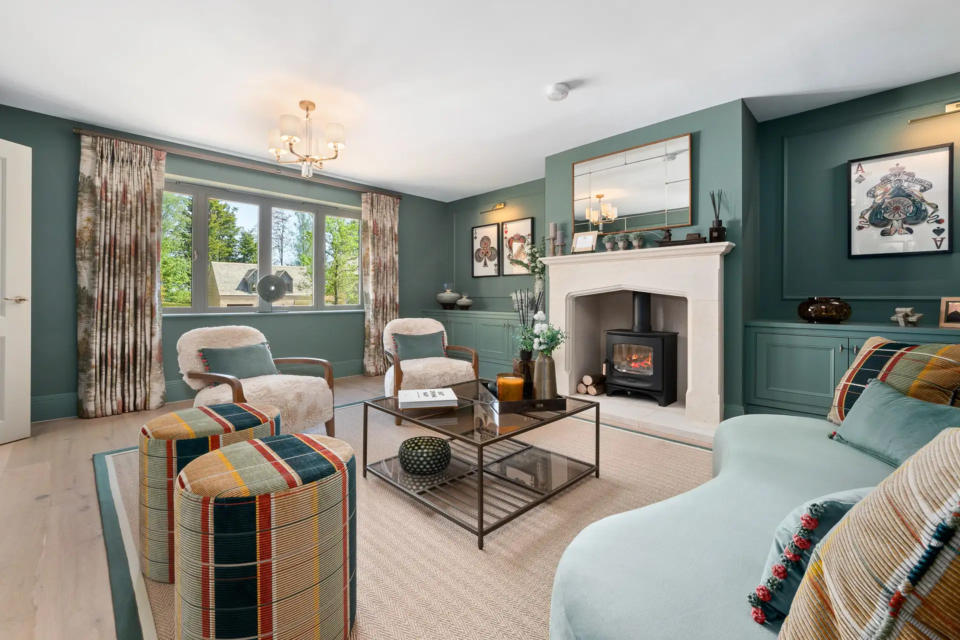 Green living room with fireplace and glass coffee table