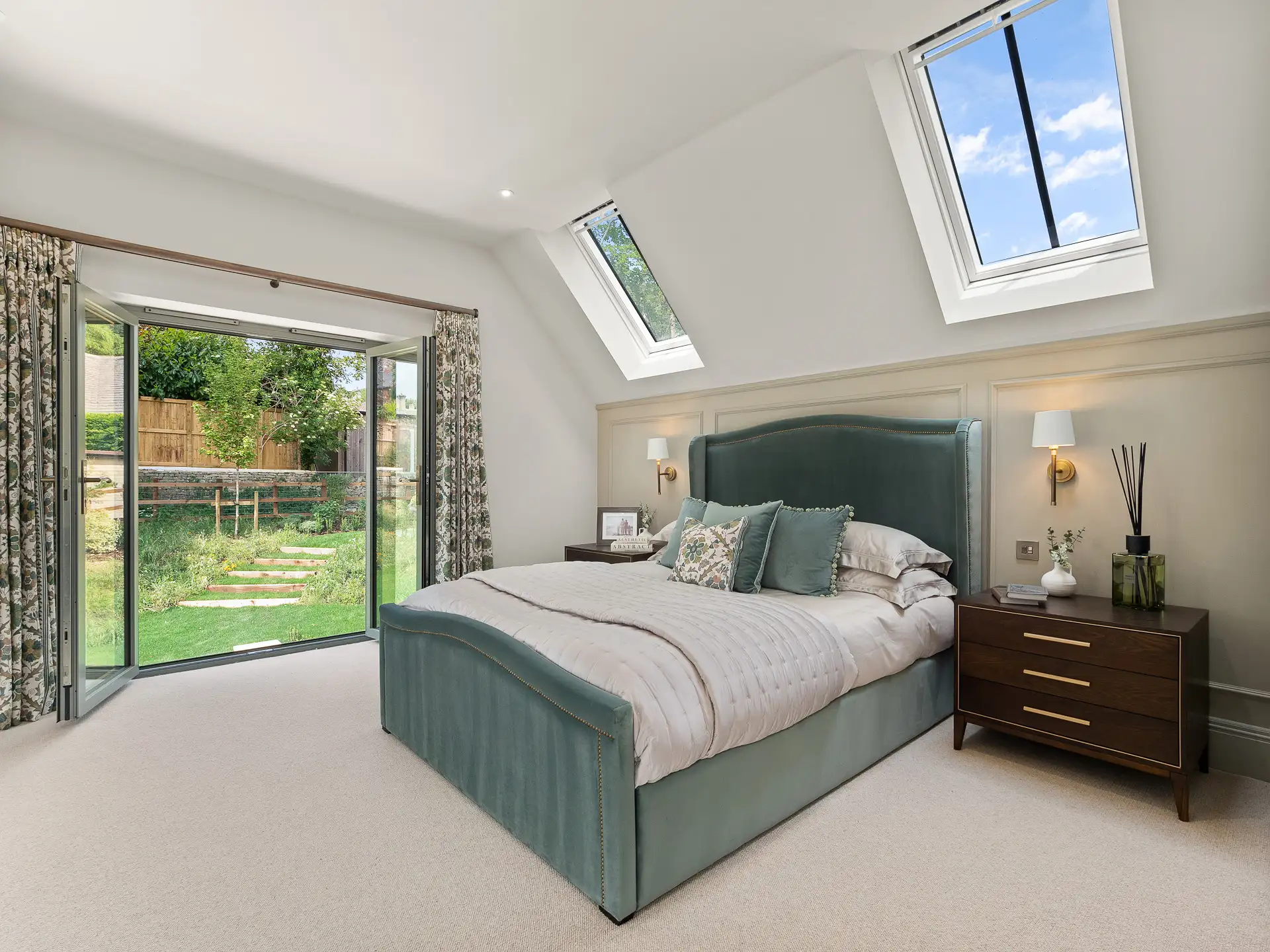 Bedroom with panelling and double patio doors