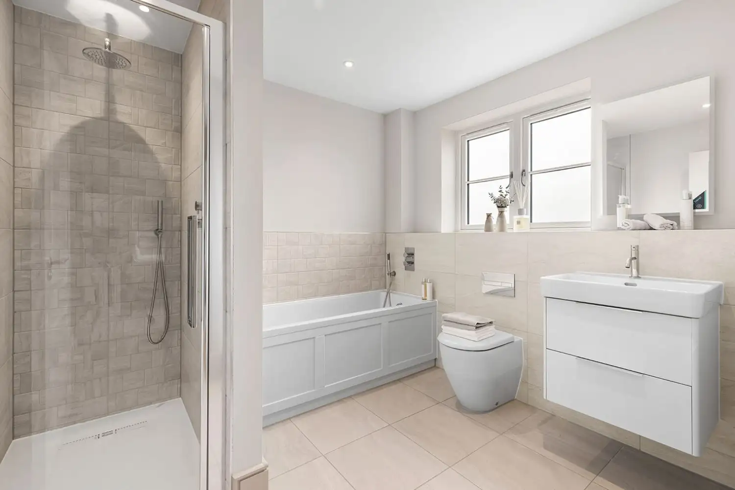 bathroom with separate shower and bath with silver hardware