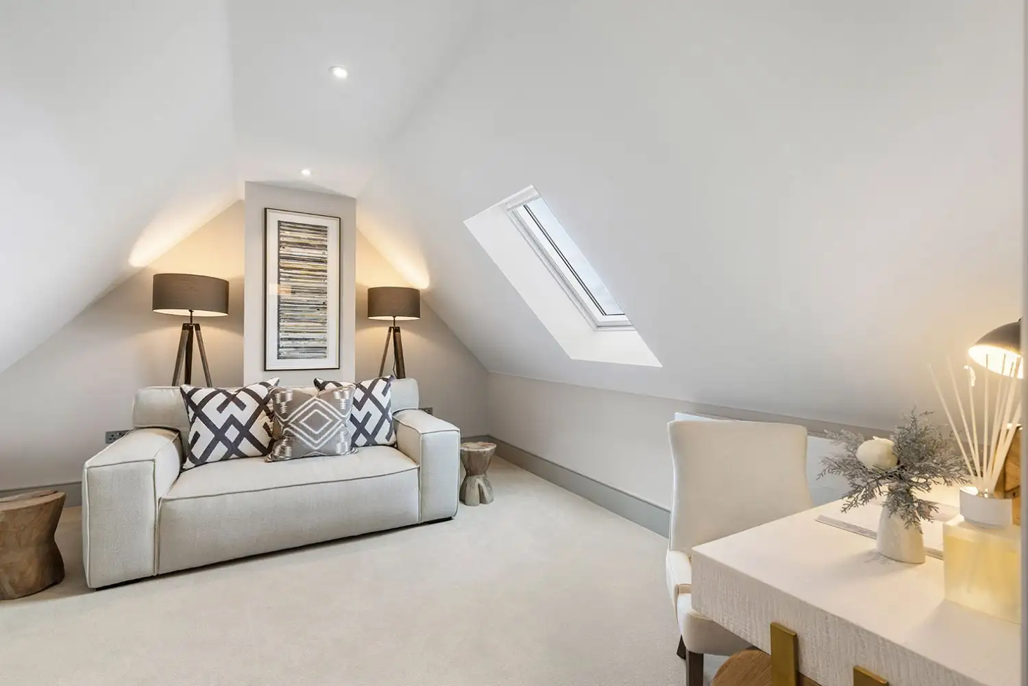 Living room and office room with slanted ceiling and sky light