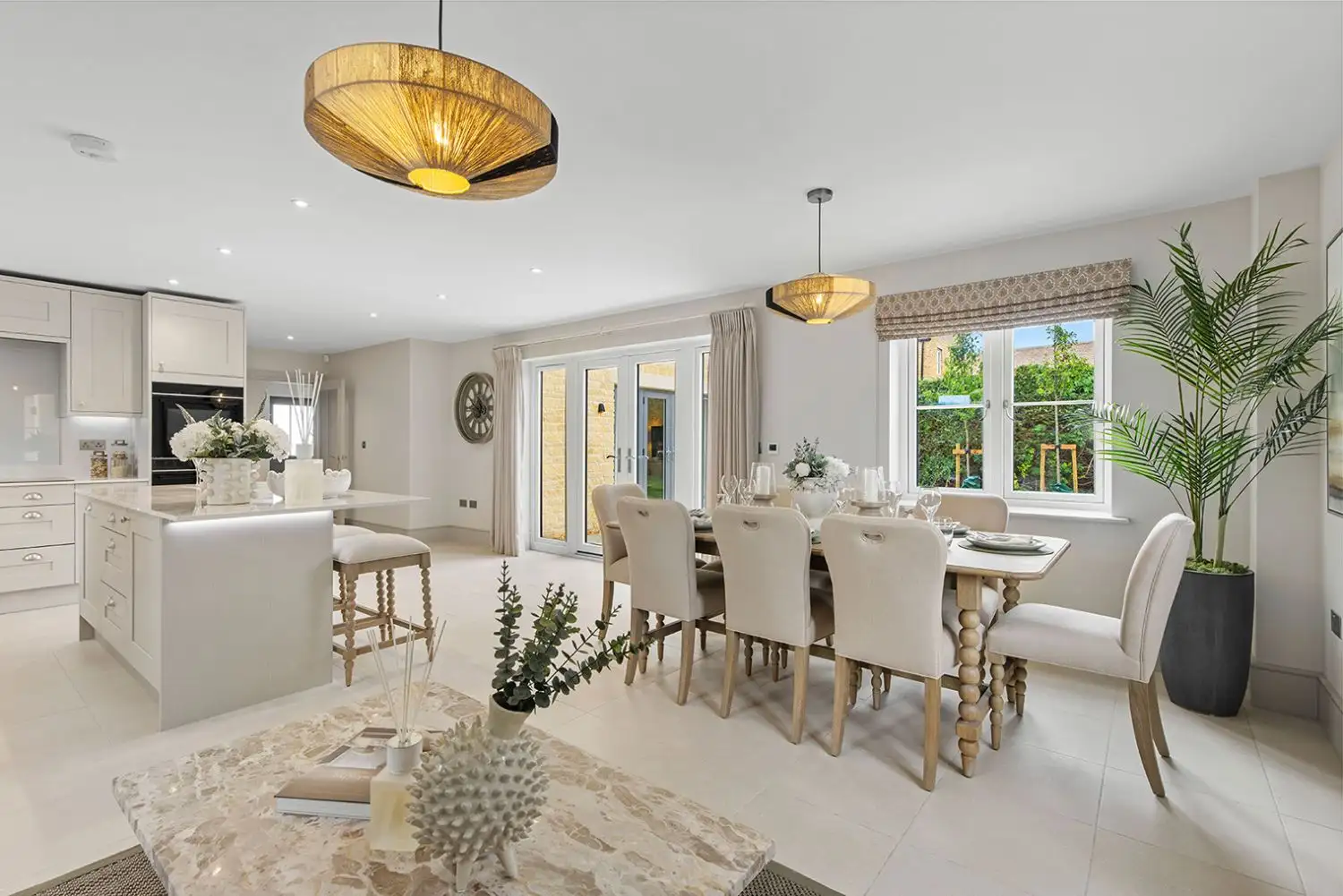 Open plan kitchen dining room with island and patio doors
